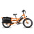 Full side view of an orange RadWagon with a fully-loaded black Ballard Cargo Bag on the rear rack.