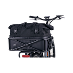 Close-up of the Large Basket Roll Top Liner inside the large basket that is mounted on the rear rack of a Rad ebike.