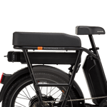 The right side of a black electric bike with a range extender and battery installed under the rear passenger seat. 